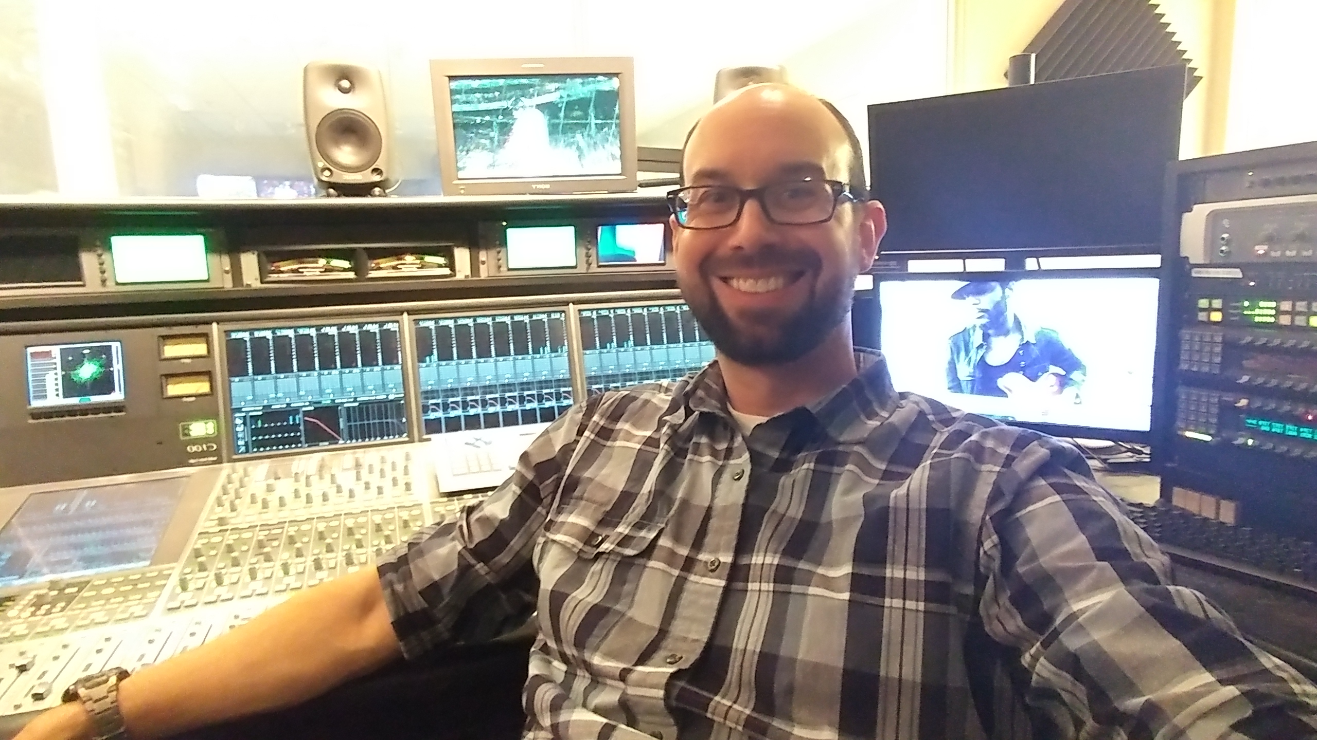 Aaron Goeglein at the broadcast audio console